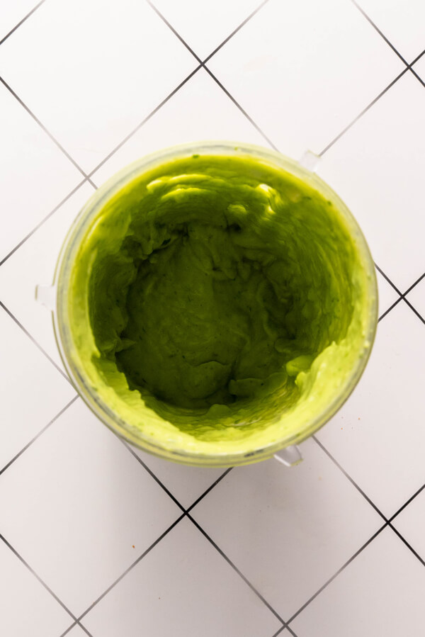 Avocado cilantro sauce inside a food processor
