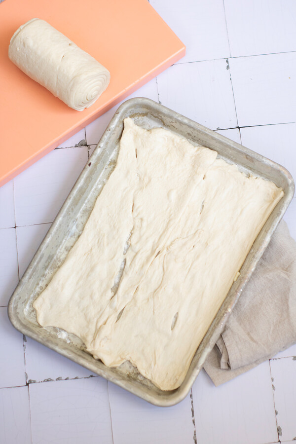 Unroll crescent roll dough on a baking pan