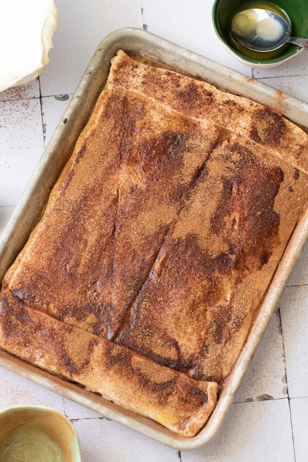 Adding cinnamon and sugar mixture