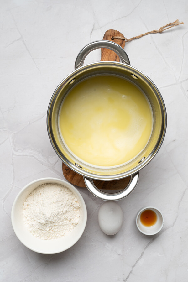 Mixing water, butter, granulated sugar, and salt
