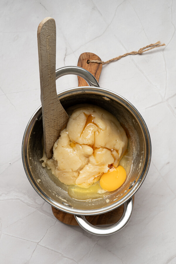 Adding the egg and vanilla extract