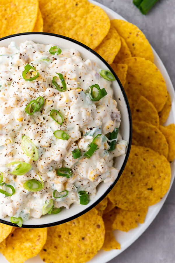 Serving corn dip with tortilla chips