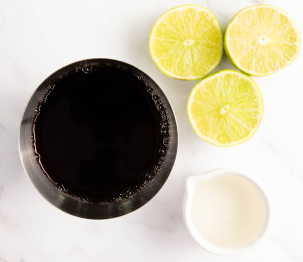 Combining cranberry juice, lime juice, and simple syrup