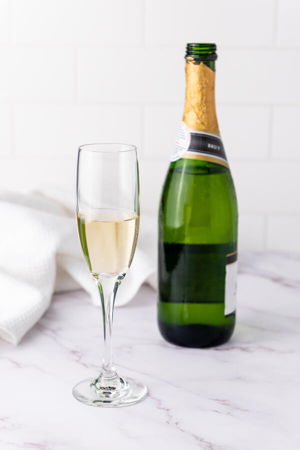 Pouring champagne on a glass