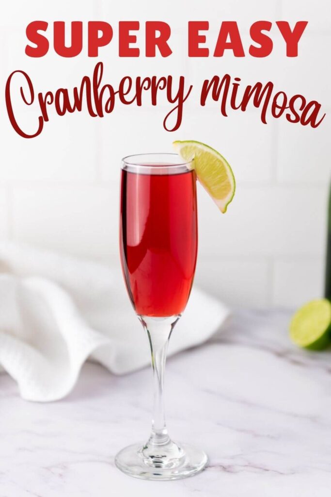 Cranberry Mimosa with a lemon wedge