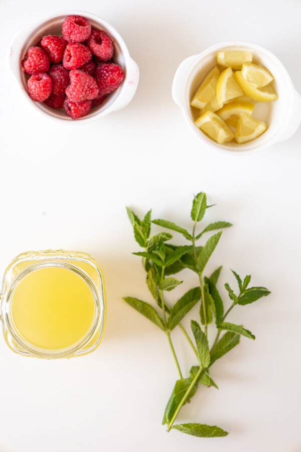 Raspberries. limes, mint leaves, and soda