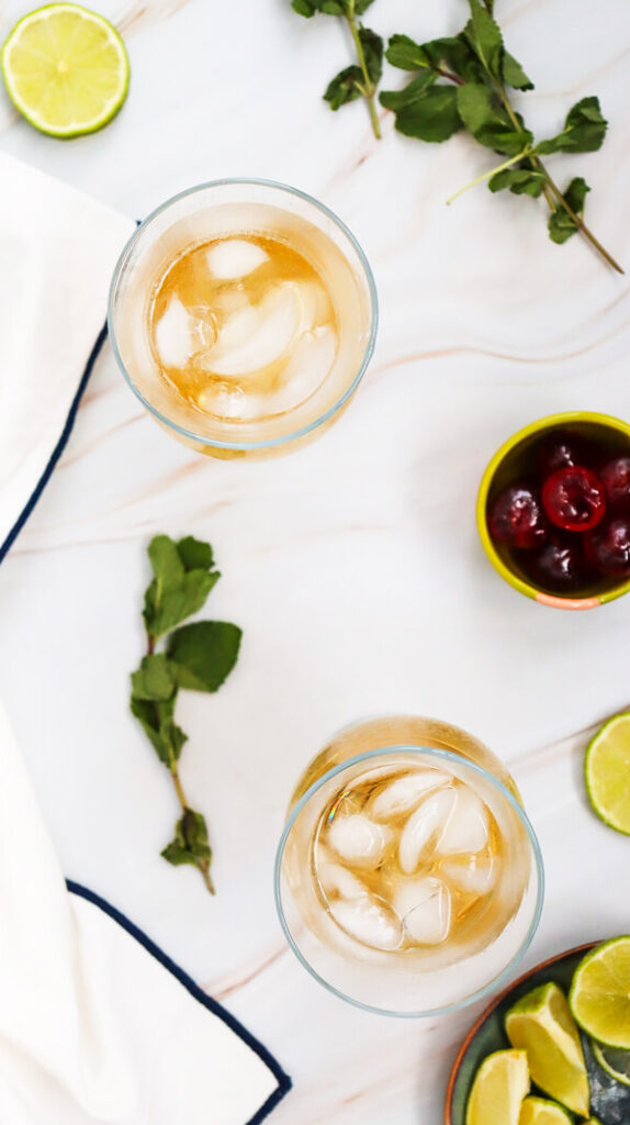 2 glasses filled with ginger ale and ice
