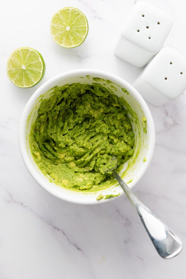 Mash avocados with lime, salt, and pepper