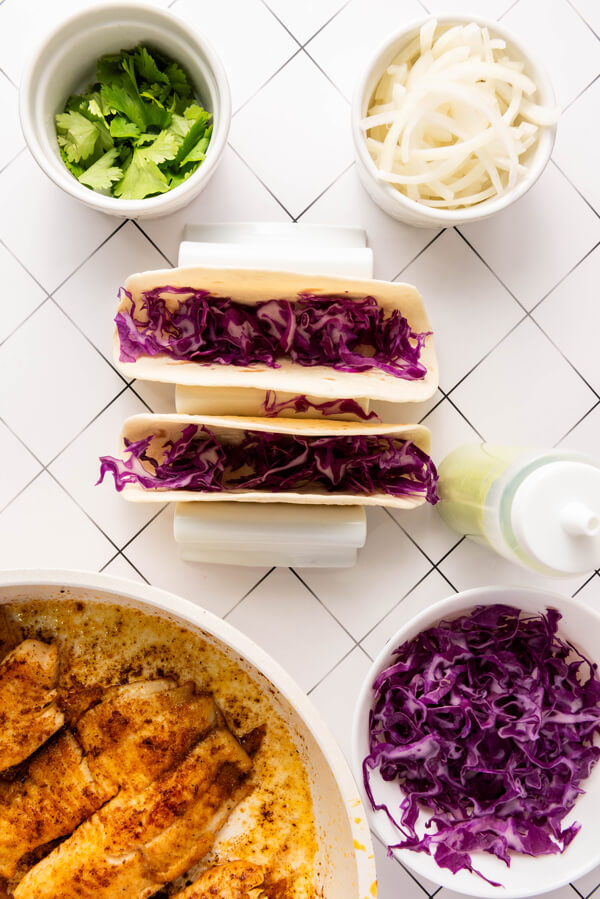 Warm tortillas with a layer of red cabbage