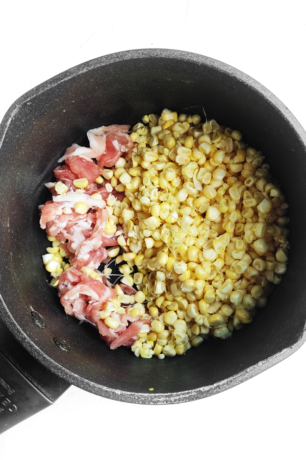 Cooking bacon and corn kernels