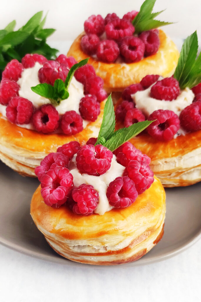 Cream Puffs decorated with raspberries