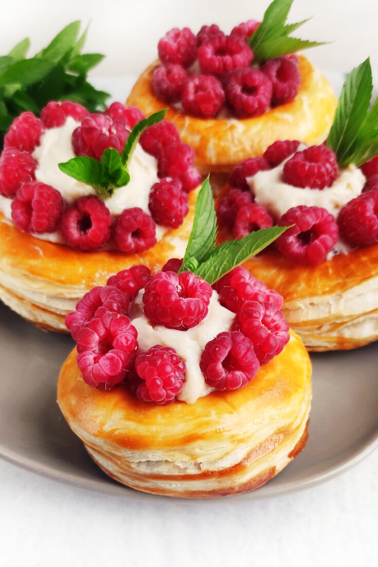 Cream Puffs decorated with raspberries