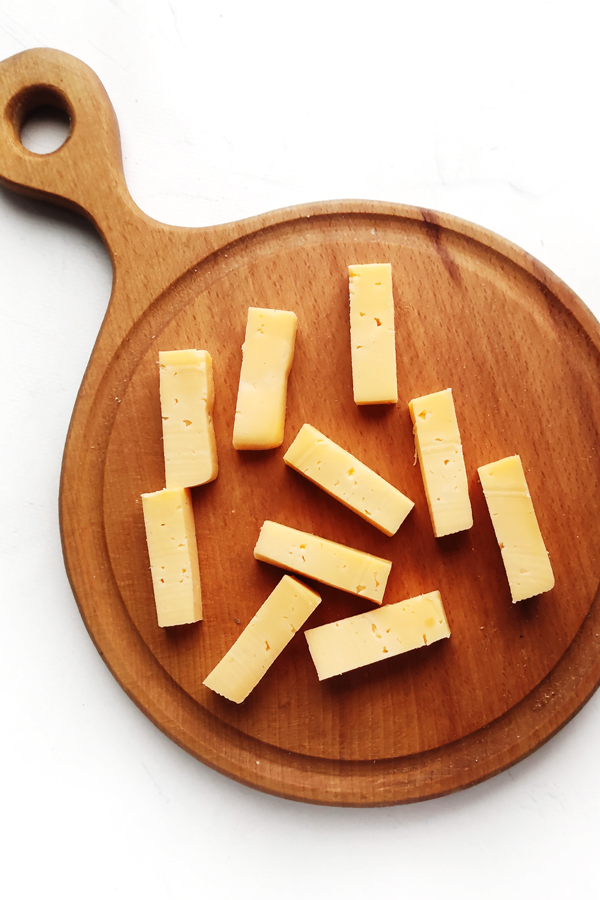 Slicing the cheese into bars