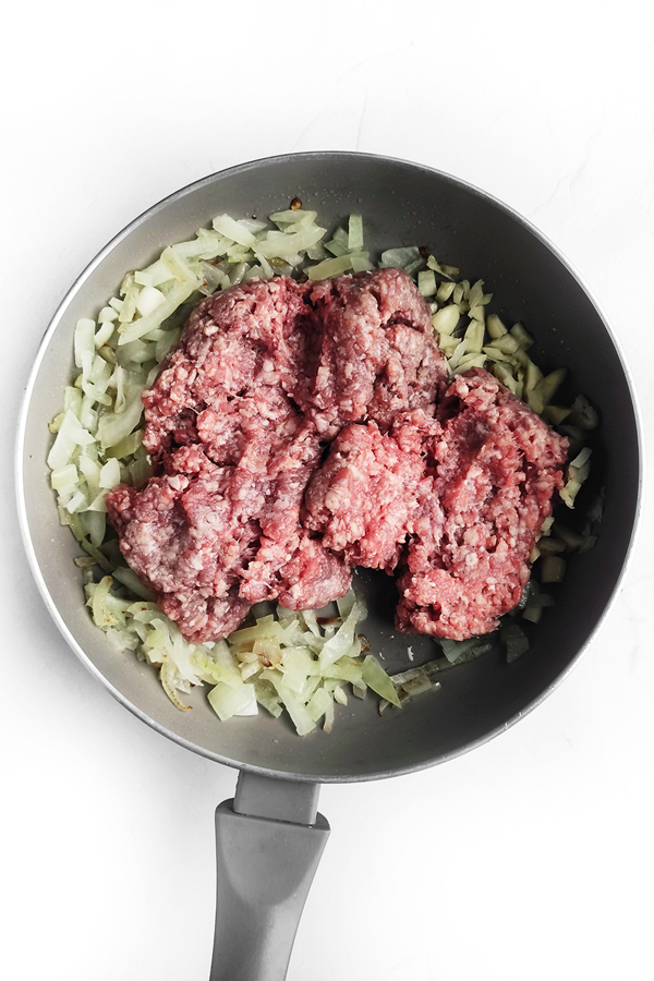 Adding the ground beef