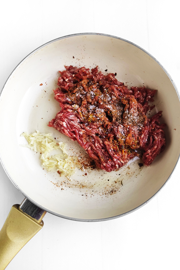 Cooking garlic, beef and all of the seasoning