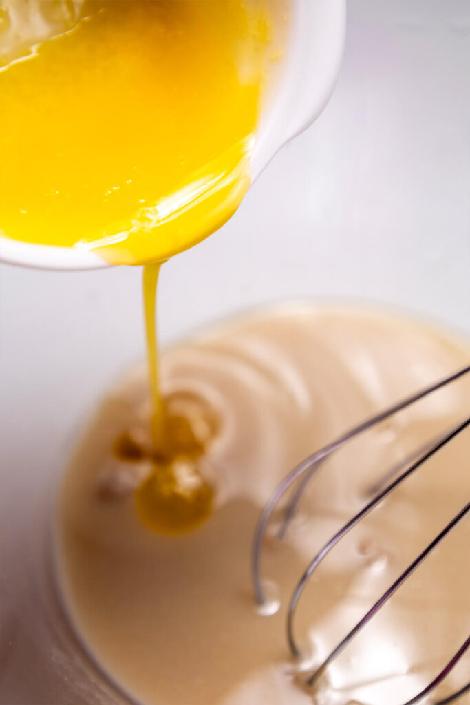 Whisking in the melted butter and eggs