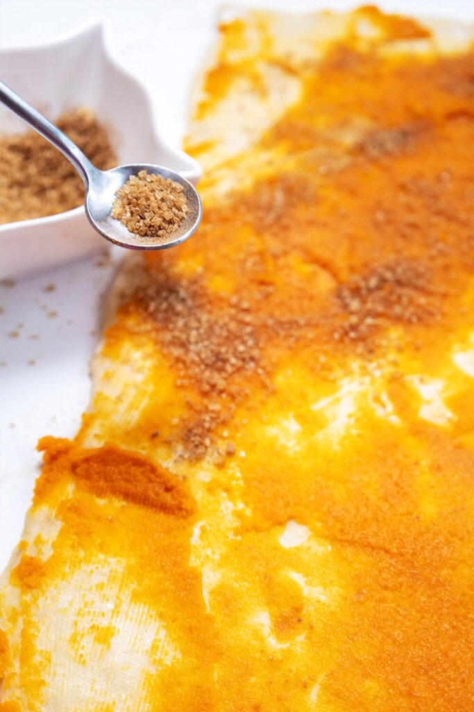 Sprinkling brown sugar, cinnamon, and nutmeg