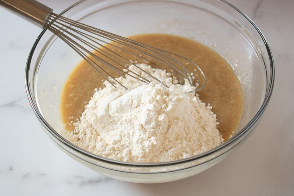 Mixing in the flour, salt, and baking soda