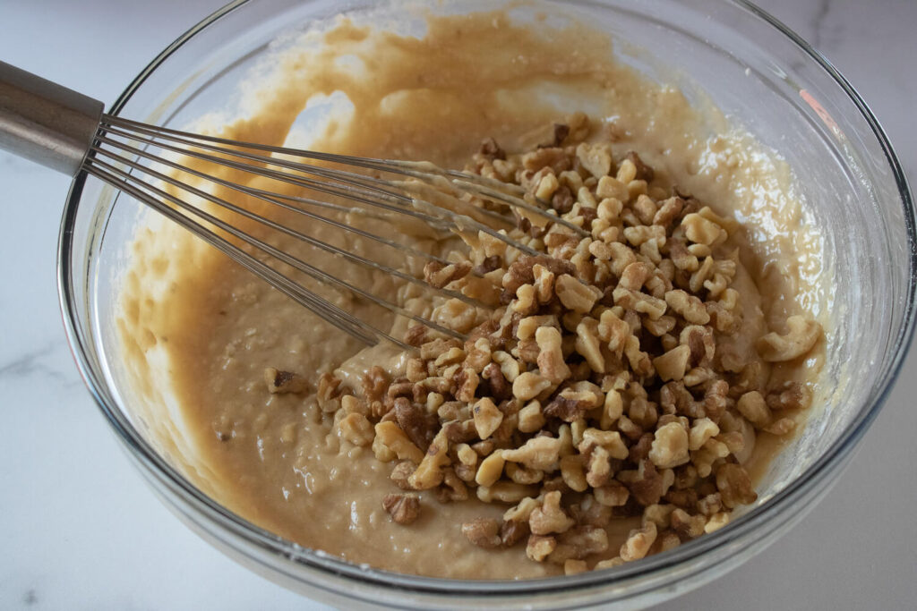 Stirring in the chopped walnuts