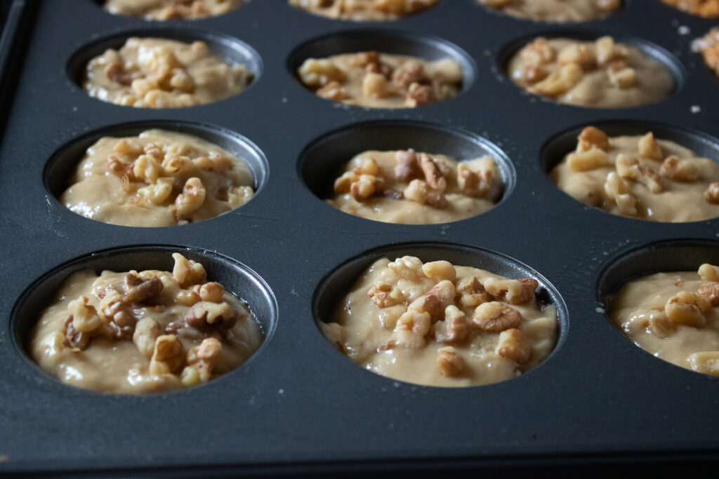 Scooping the batter into the muffin tin