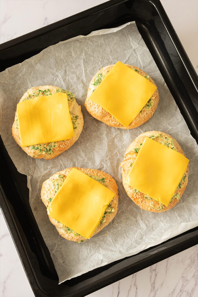 Placing a slice of cheddar cheese