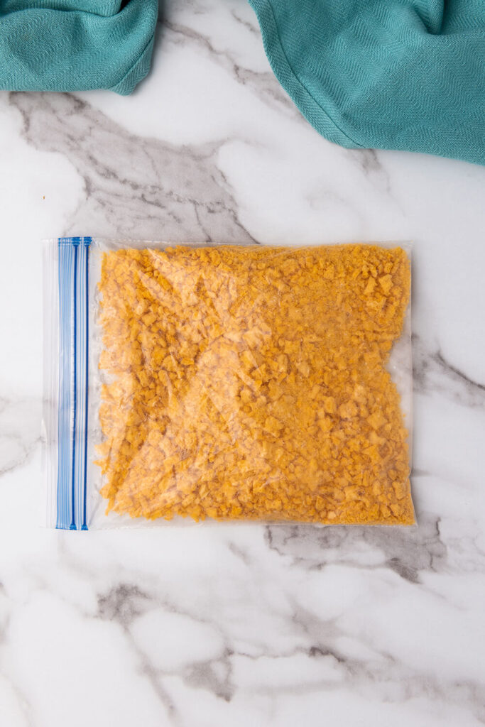 Crushing the Cap’n Crunch cereal inside a plastic bag