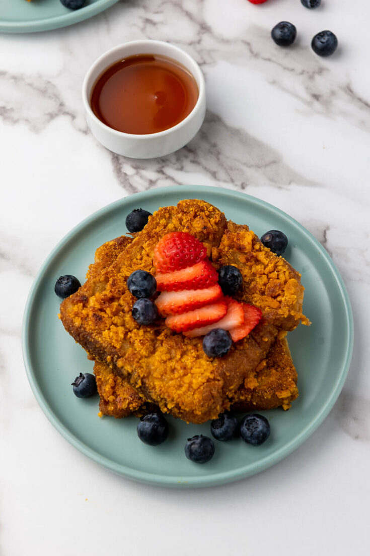 Serving the crunchy French toast with fresh berries and maple syrup