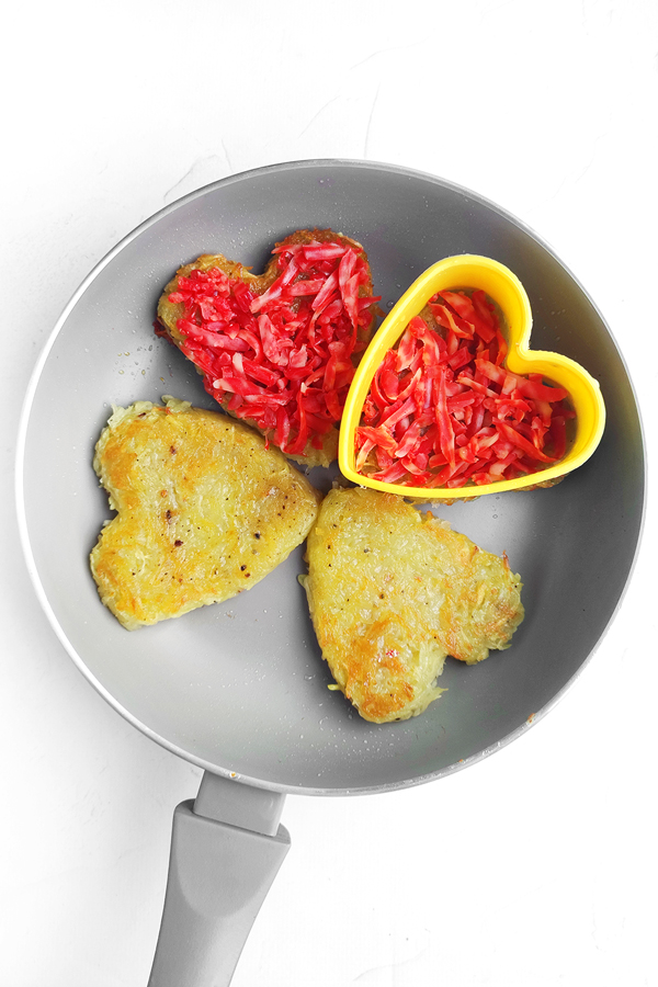 Adding the red cheese on top
