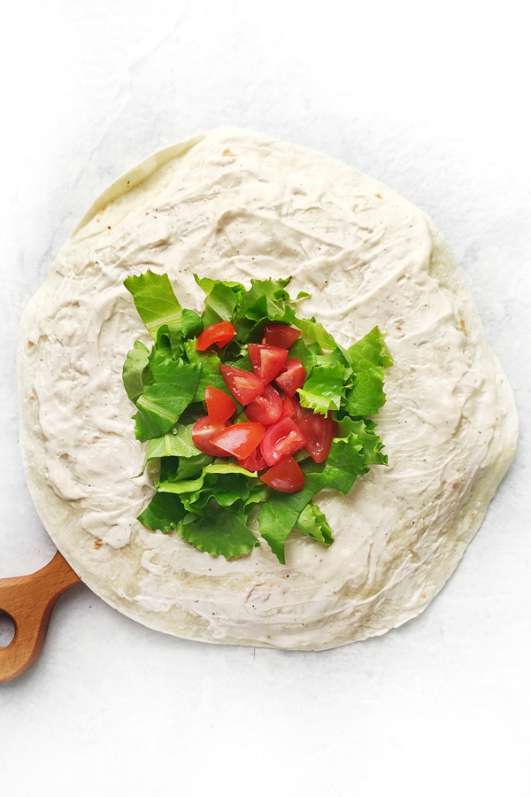 Adding lettuce and  cherry tomatoes