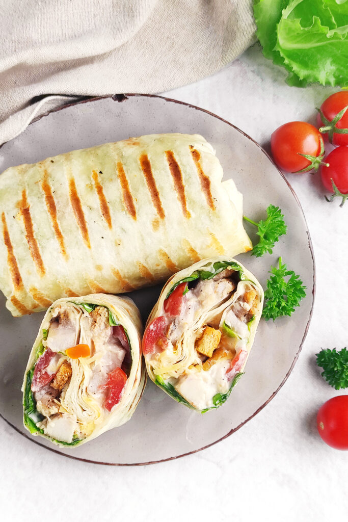 Slicing your chicken Caesar wraps in half for serving