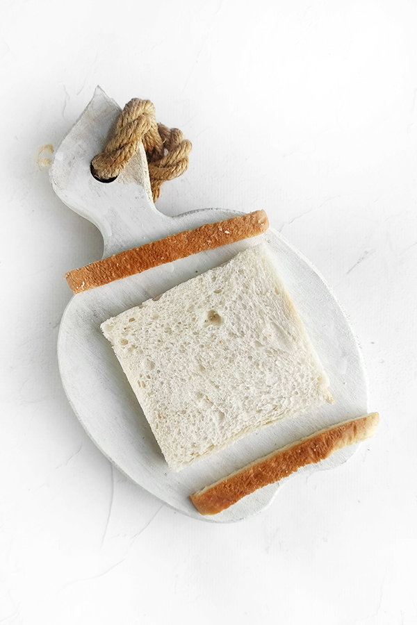 Cutting the crust off the bread