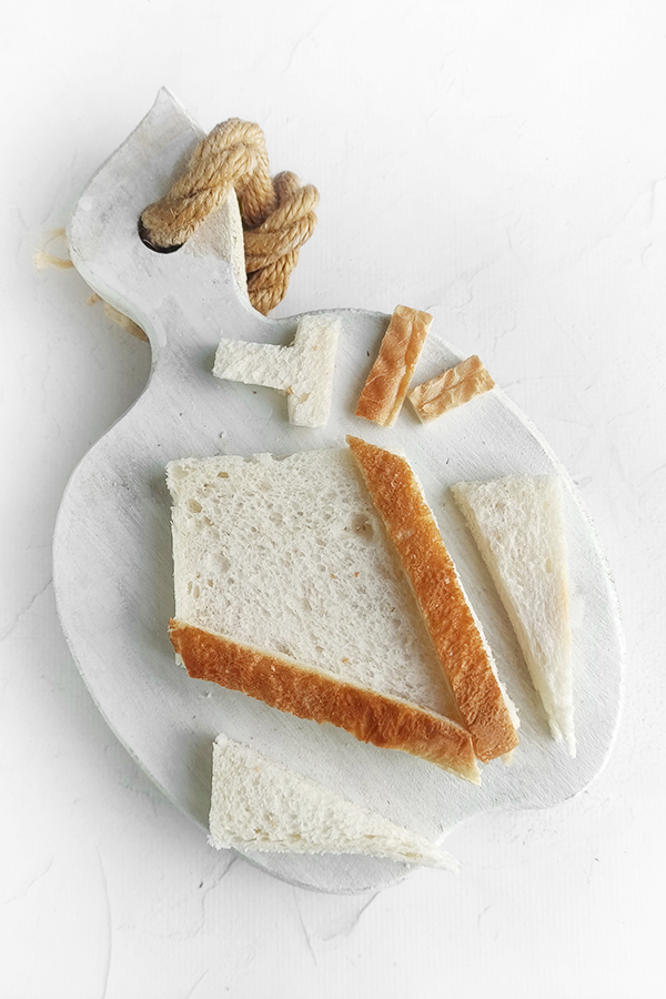 Cutting the bread into a cup