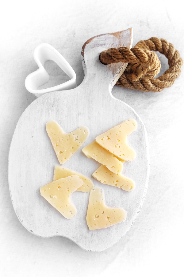 Cutting heart shaped cheese