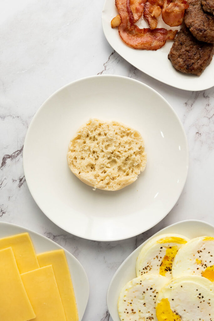 Bottom half of an English muffin on a white dish