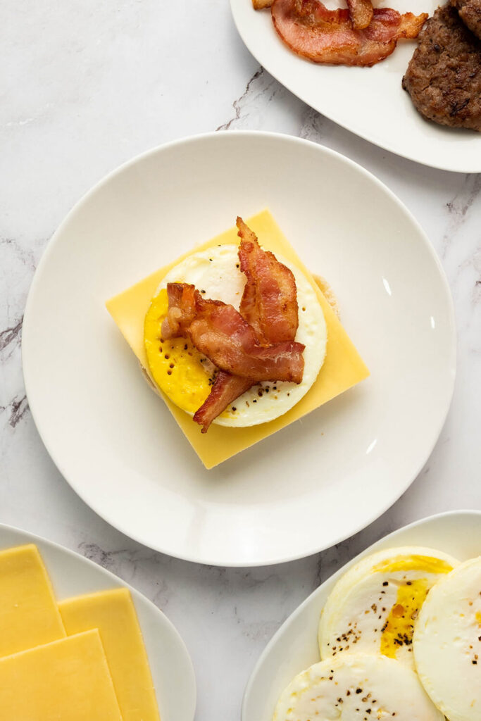 Adding an egg and two pieces of bacon