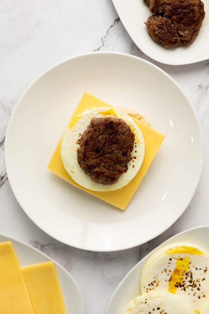 Adding an egg and a sausage patty