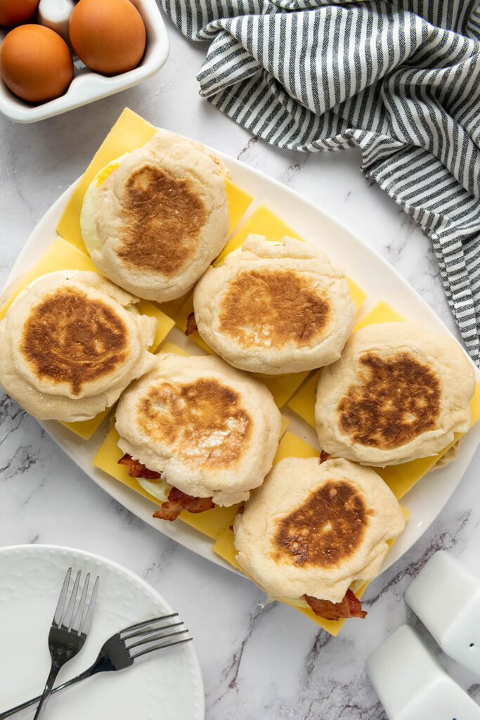 Adding the other half of the English muffin to all of the sandwiches