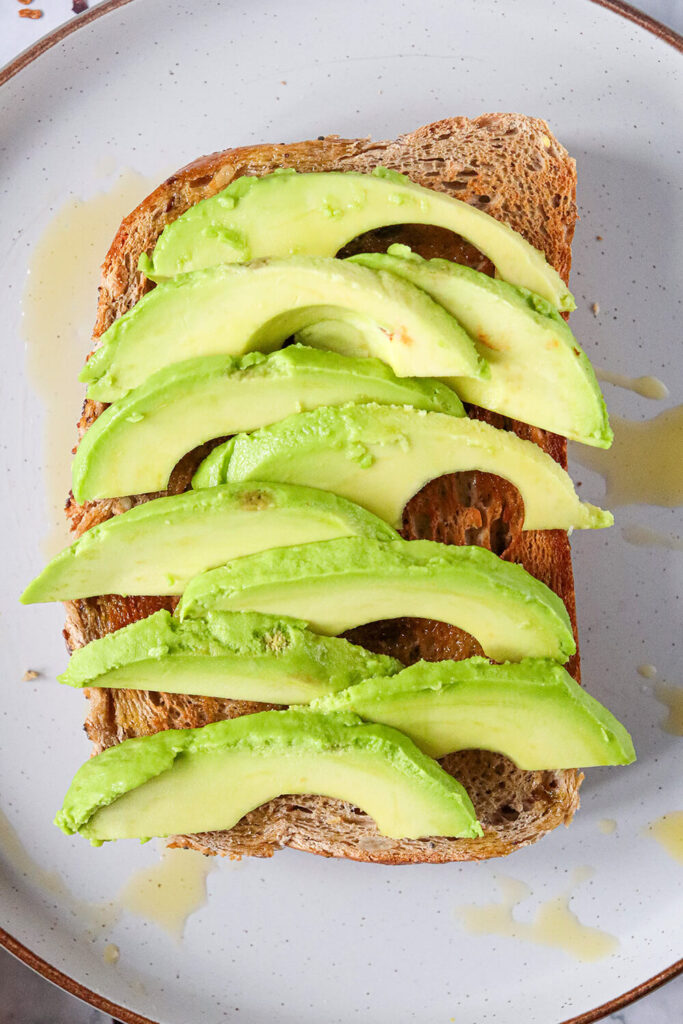 Placing avocado on the toast