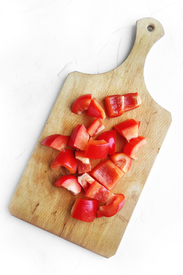 Diced red pepper on a cutting board