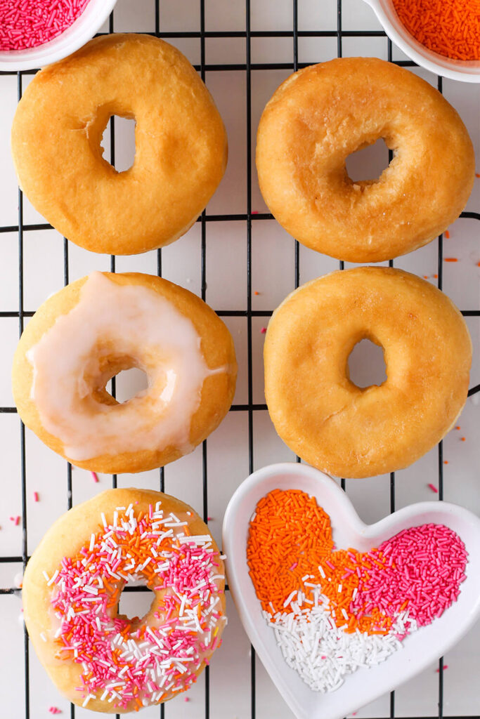 Adding orange, pink, and white sprinkles