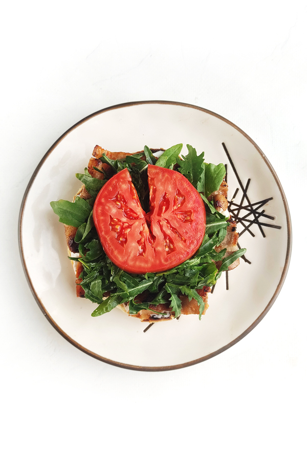 Adding arugula and tomato