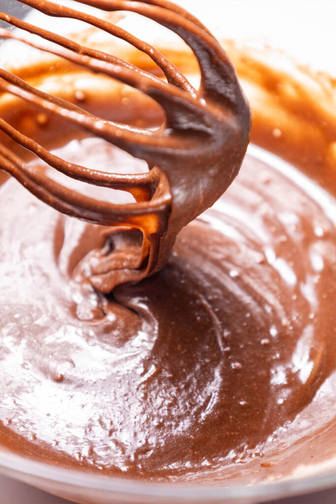 Mixing the brownie mix, water, egg, and oil