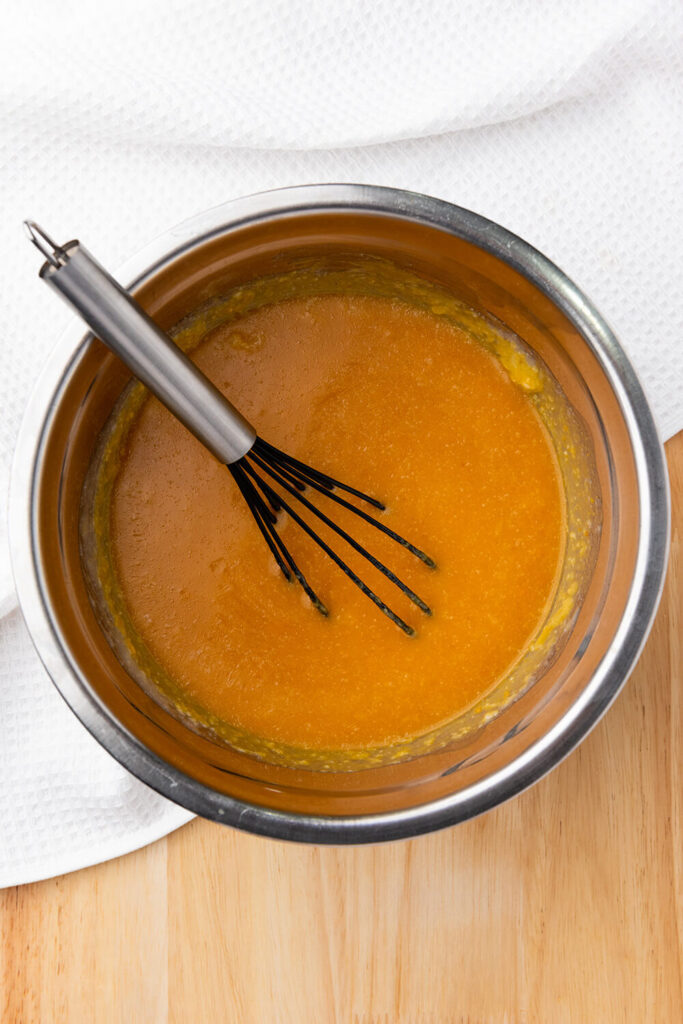 Mixing  pumpkin puree, oat milk, coconut oil, and sugar 