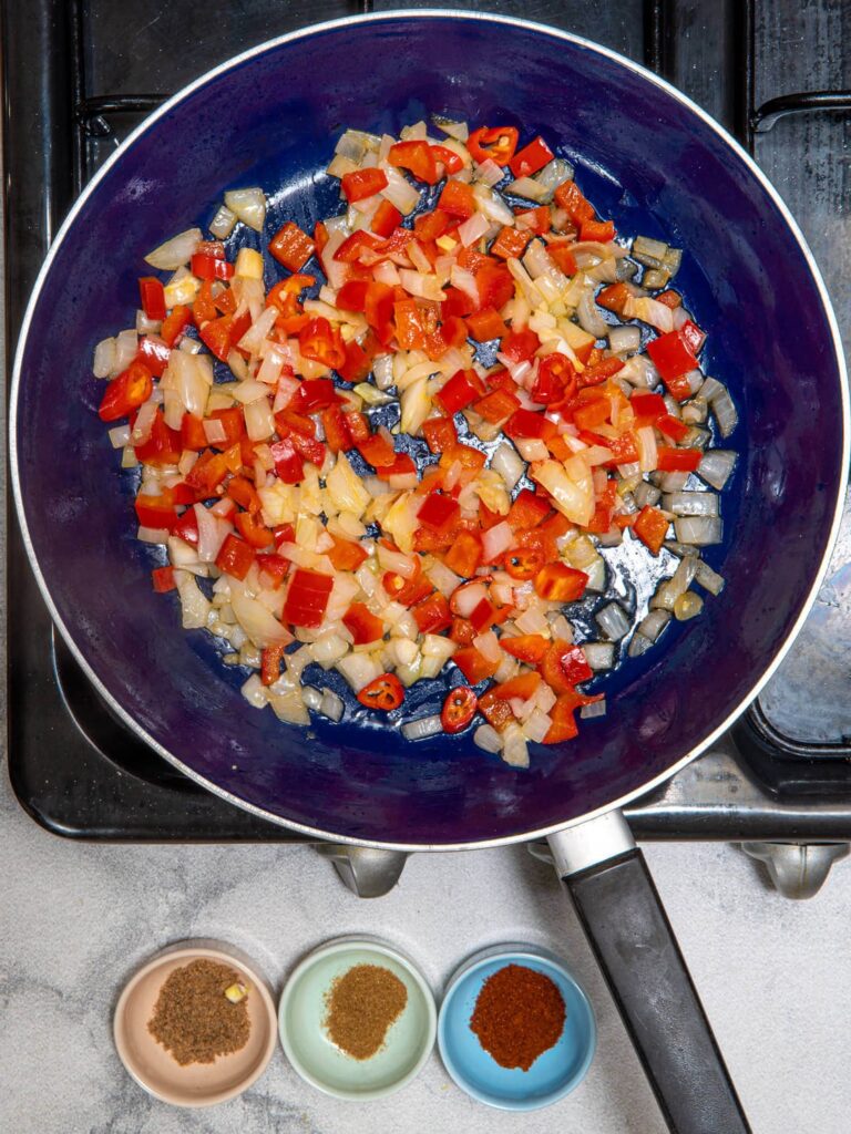 Sauteing onions, bell pepper, and chili