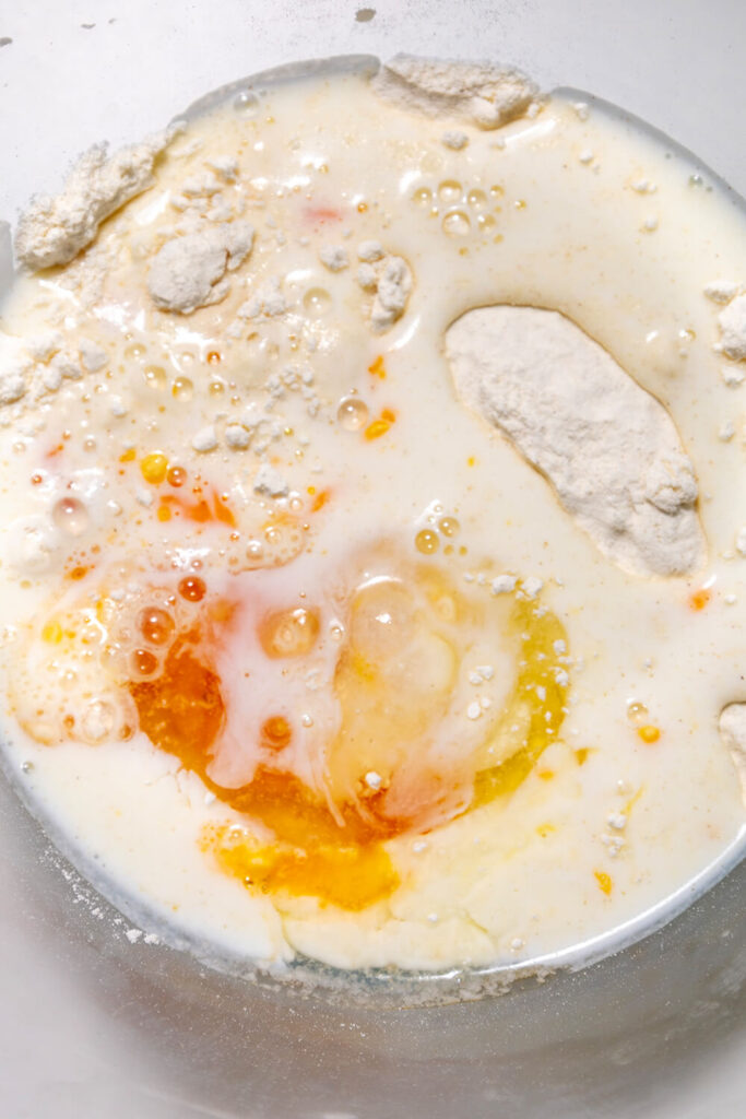 Adding the milk, melted butter and eggs