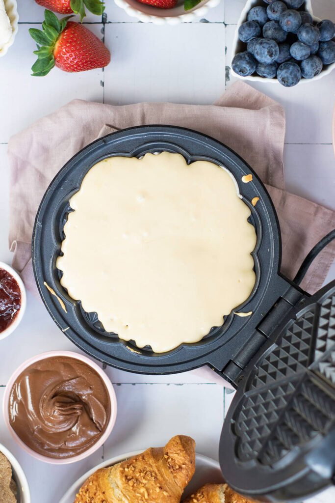 Pouring the batter into the waffle maker