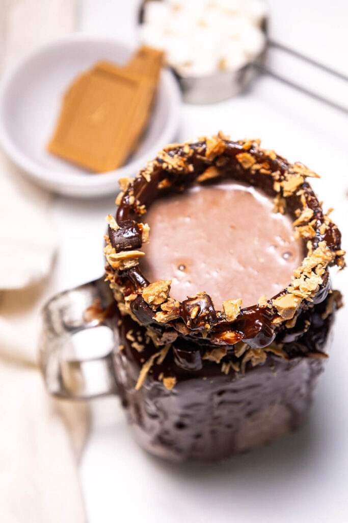 Adding shredded salted caramel chocolate on the rim