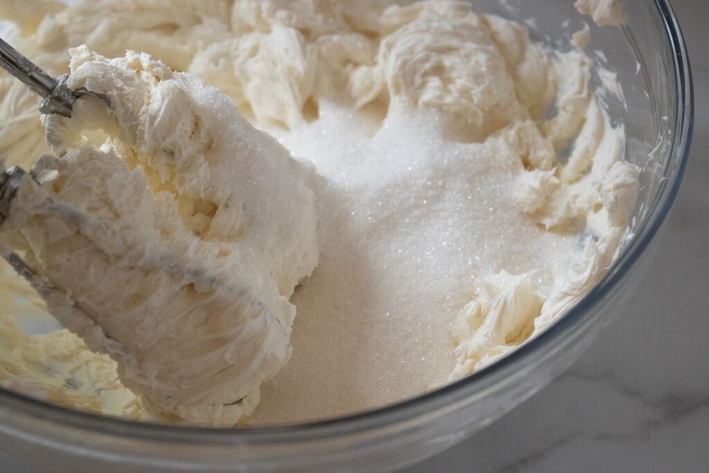 Mixing cream cheese and sugar