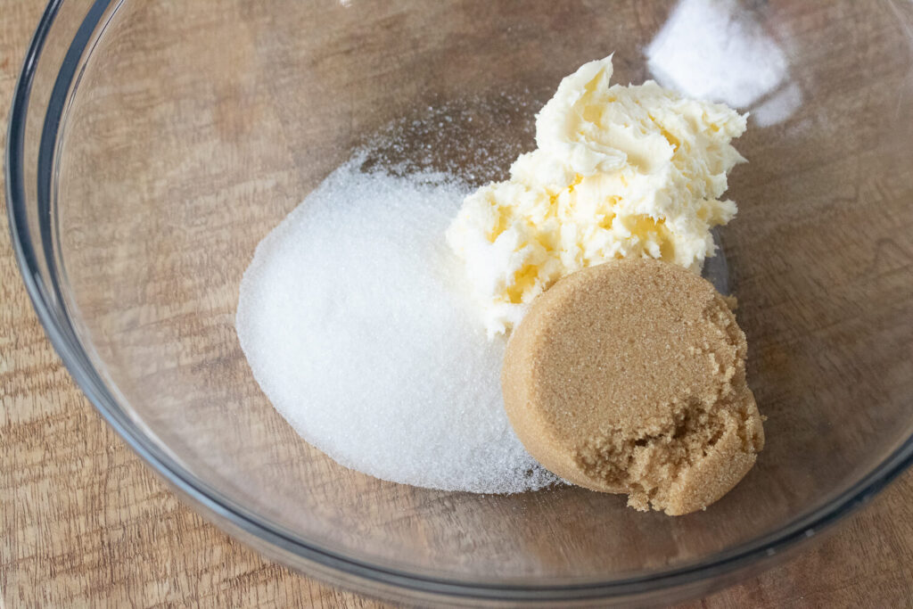 Mixing butter, brown sugar, and granulated sugar