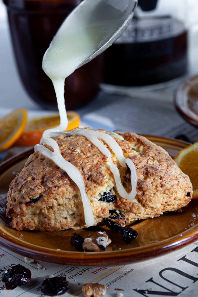 Serving the Orange Cranberry Scones with a drizzle of orange glaze